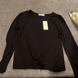 Pinc premium black Tshirt with twisted front size large.